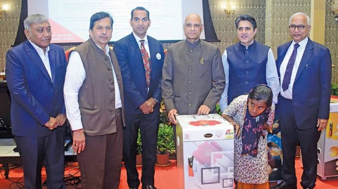 Gift of sewing machine and flour mill to the disabled in the presence of the Governor