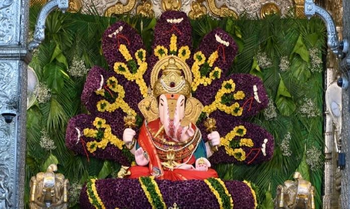 floral-decoration-of-seshnaga-replicas-in-dagdusheth-halwai-ganapati-temple-pune