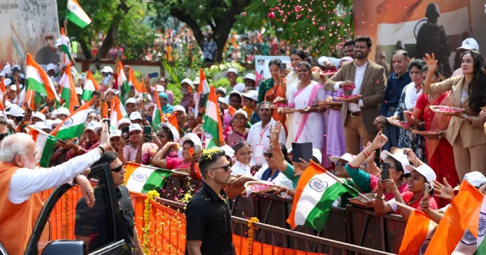 pm narendra modi Holds roadshow in vadodara colonel sofiya qureshi family showers flowers on him